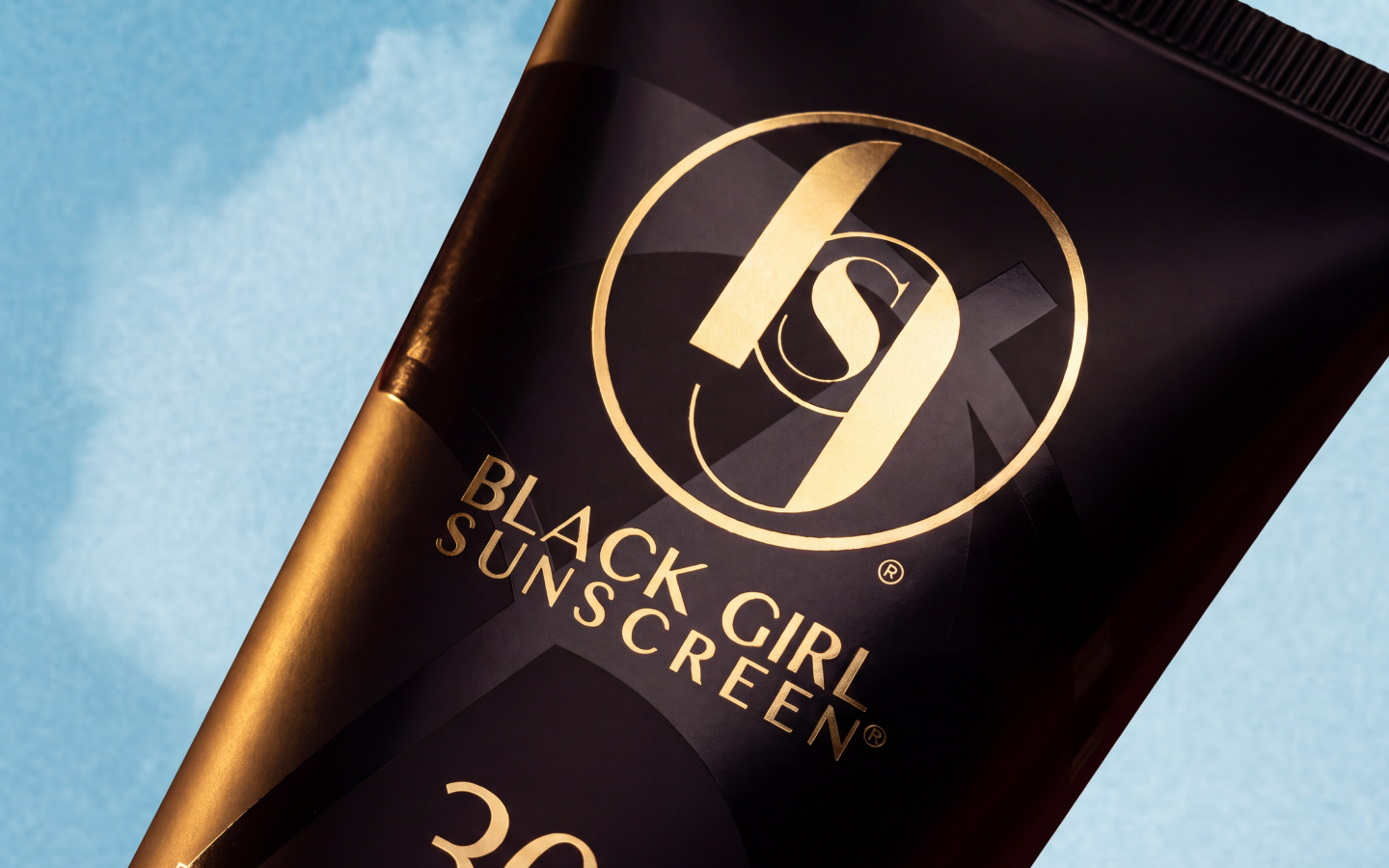 Black Girl Sunscreen SPF 30 packaging displayed on a retail shelf